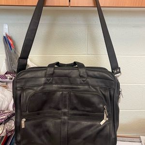 Black leather tote bag. Used.